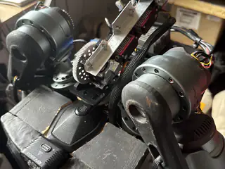 Top-down view of R.O.B.’s upper body, shoulder motors, central gears, and braided wiring.