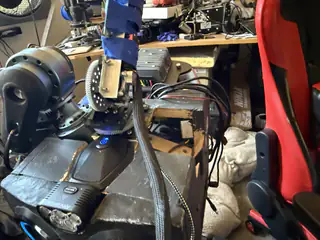 Upper rear view of R.O.B. with taped central mechanism, shoulder motor, exposed wiring, and open side cavity.