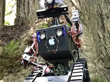 An early R.O.B. prototype on tracks in a wooded setting