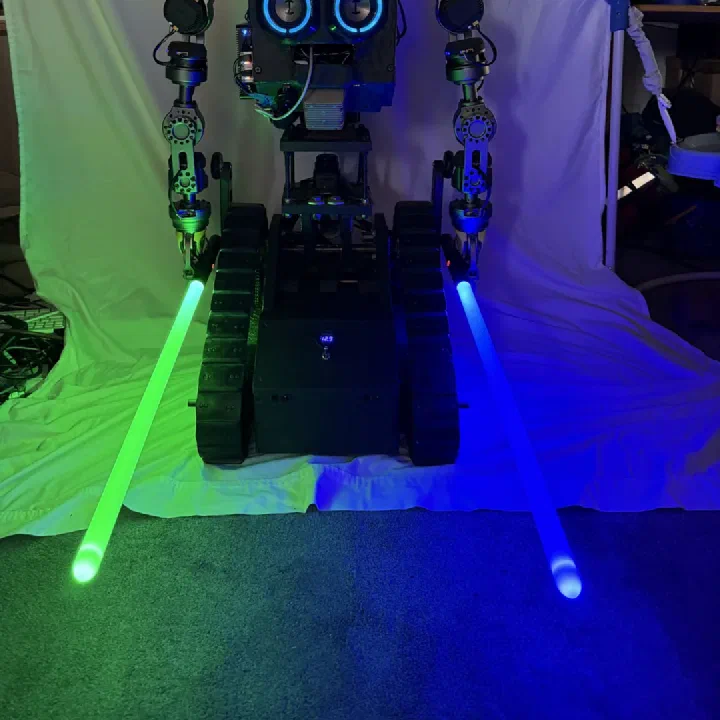 R.O.B., Orbitus Robotics' tracked humanoid platform, illuminated with green and blue lightsabers